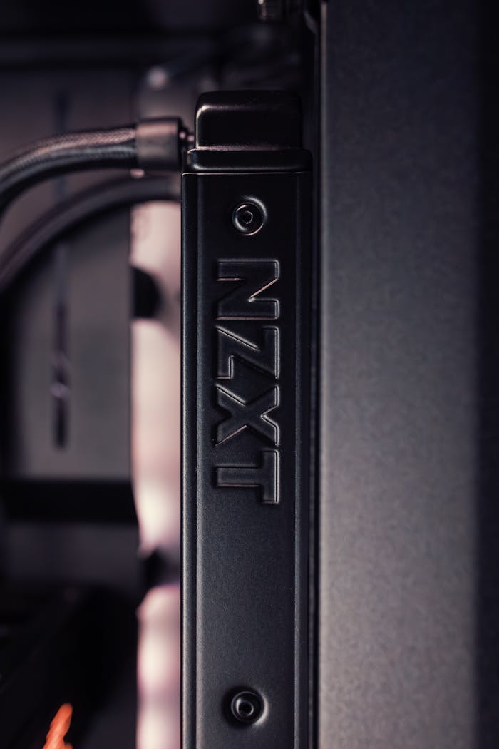Detailed view of a NZXT computer case component with black and gray tones.